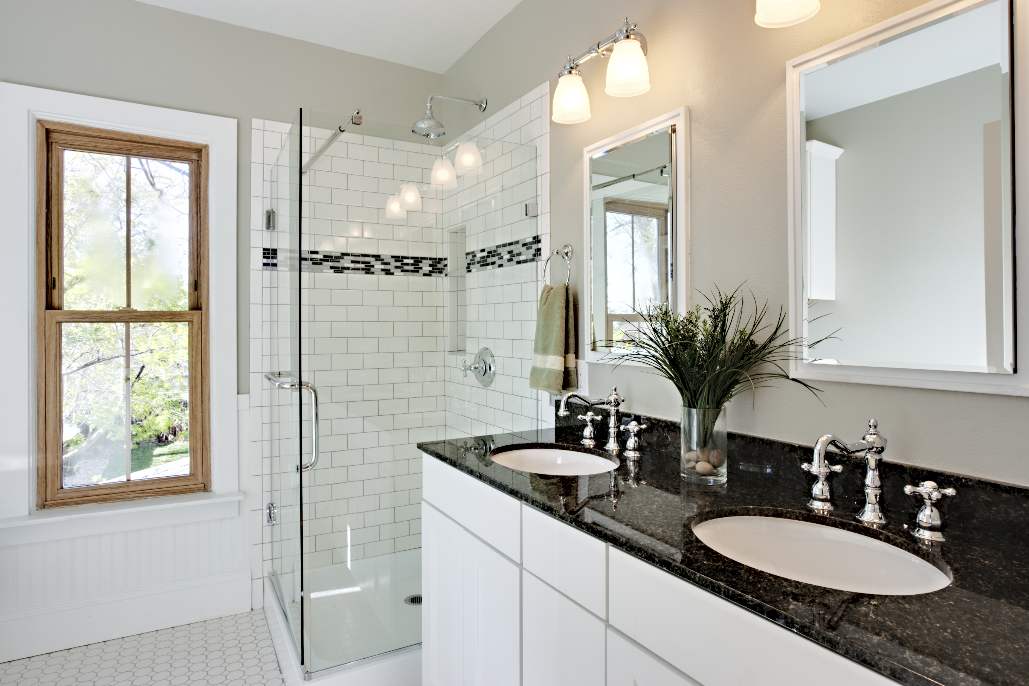 Completed bathroom renovation and glass shower enclosure