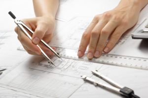 Floor plan designer draws up blueprints for a small custom house