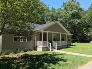 Covered front porch addition recently completed by home contractors at H&H Builders, Inc.